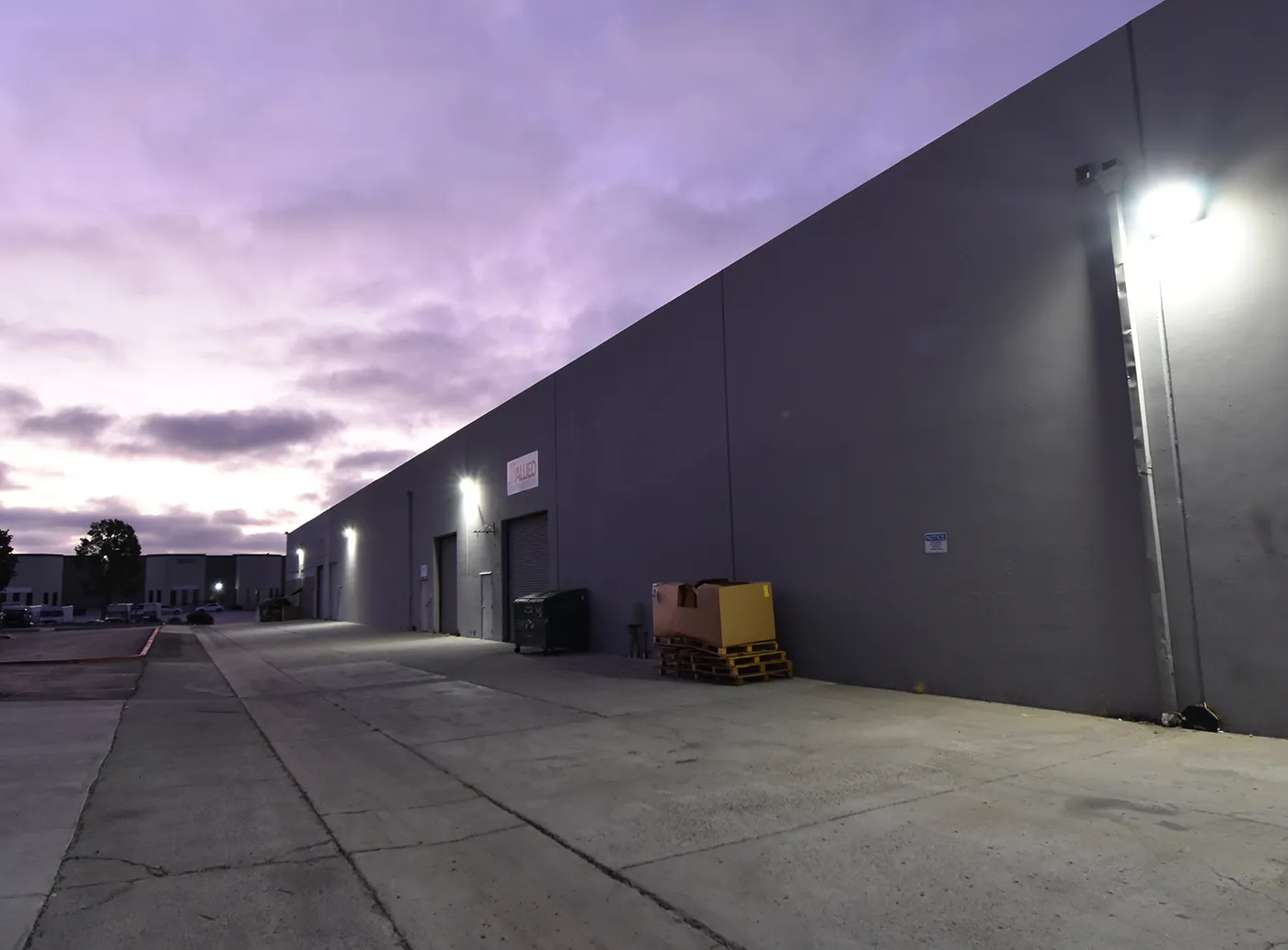 Wall pack lights installed on the side of a building